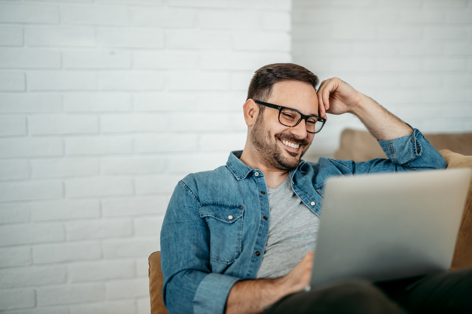 Man smiling while looking at successful Buy Now, Pay Later integration with Uplift